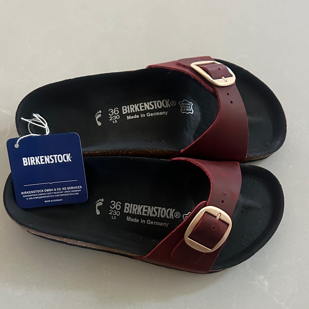 Birkenstock women’s Single Strap Slide Sandals in Burgundy with Gold Buckles